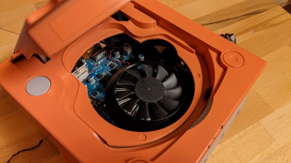 Gamecube with disc drive open, showing GPU in this PC conversion