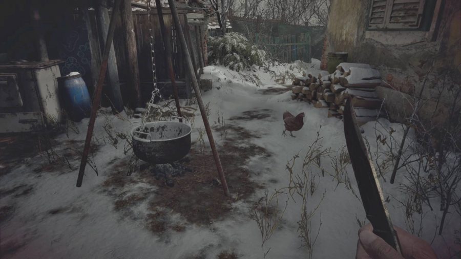 A chicken is walking between a hanging pot and a house in Resident Evil Village.