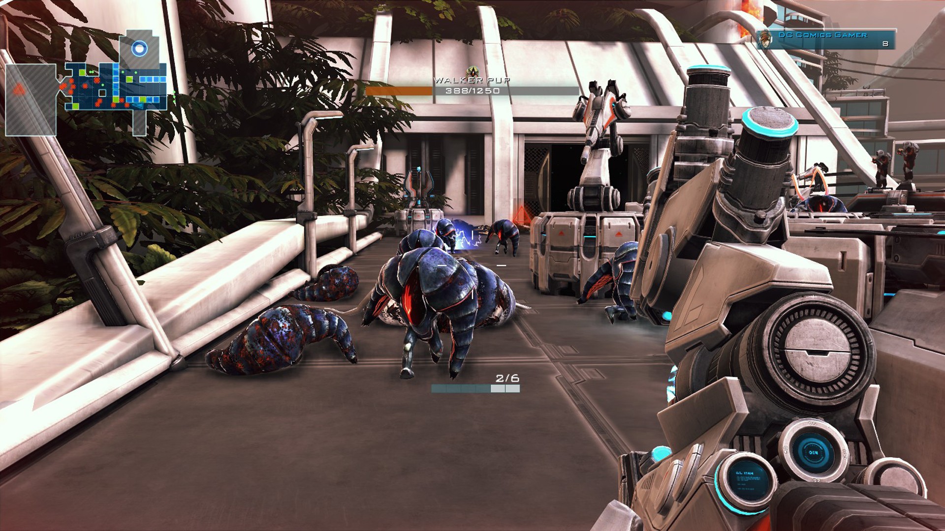 Best tower defense games: a swarm of small insectoid bipeds walking past gun turrets in Sanctum 2.