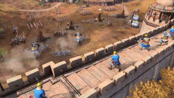 Delhi sultanate soldiers atop a city wall repel invaders in age of empires 4