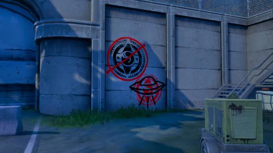 Two alien-based pieces of graffiti on the wall in Fortnite