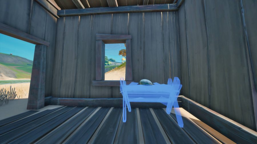 A blue outline of a wooden hatchery in Fortnite