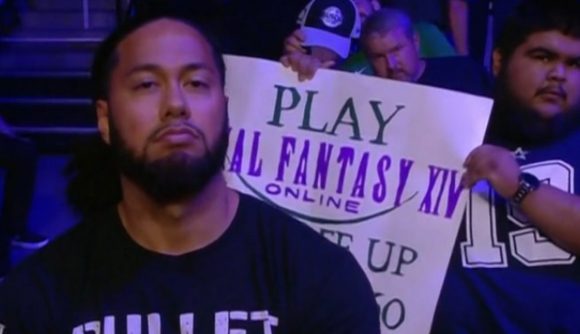 Pro wrestler Hikuleo, seated just in front of a fan with a Final Fantasy XIV sign