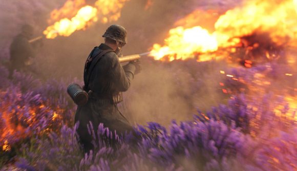 A soldier in Battlefield V sprays a flamethrower at a field