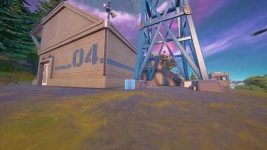 One of the outlines to plant wiretaps in Fortnite. It's at the base of a radio antenna.