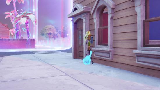 A Fortnite welcome gift package placed outside a house in Holly Hatchery. There is a purple anti-gravity field nearby.