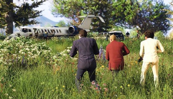Three GTA Online players approach a plane