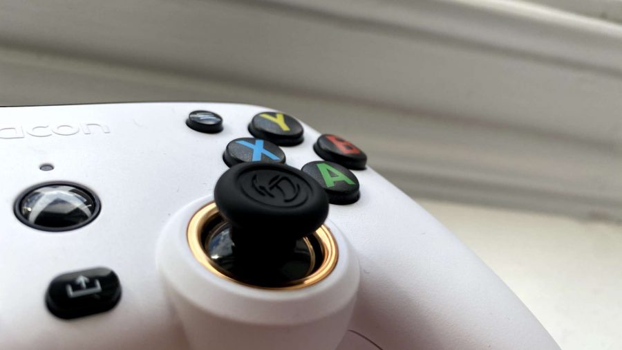 A close-up of the thumbstick with an imprinted Nacon logo