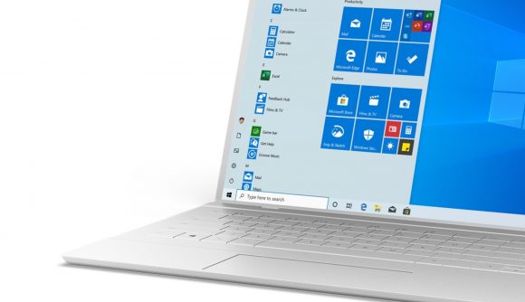 A white laptop running Windows 10 with the start menu open