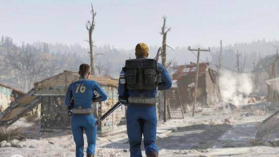 Two vault dwellers walk down a road that leads through a ruined town in Appalachia in Fallout 76
