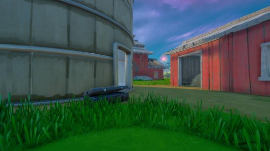 One of the Fortnite alien samples delivery locations at the base of a grain silo.
