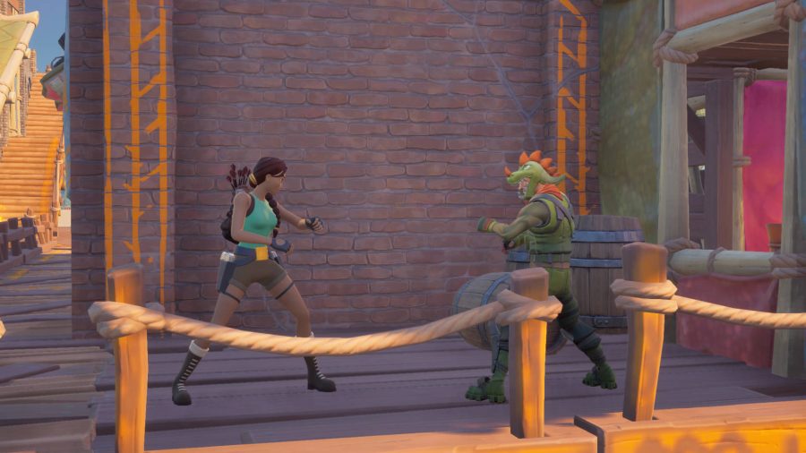 Lara Croft is shadowboxing against a trespasser disguised as Rex in Fortnite.