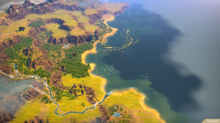 A neolithic tribe exploring a coastline in strategy game humankind