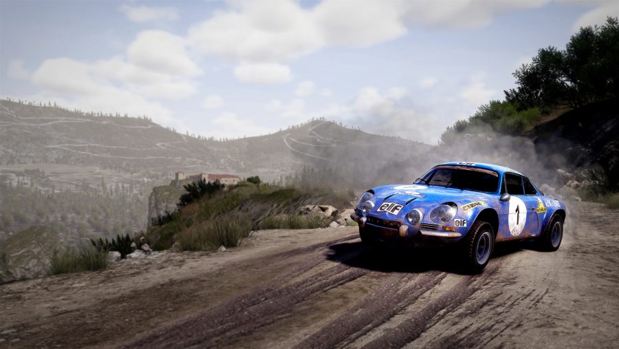 A classic rally car sliding around a mountain trail in WRC 10