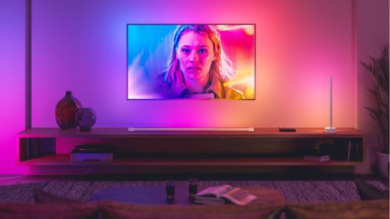 Philips Hue lighting shines brightly behind a Philips branded television, mimicking what's on screen
