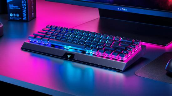 Razer's BlackWidow V3 Mini Hyperspeed is a compact keyboard sitting on the desk below the gaming monitor