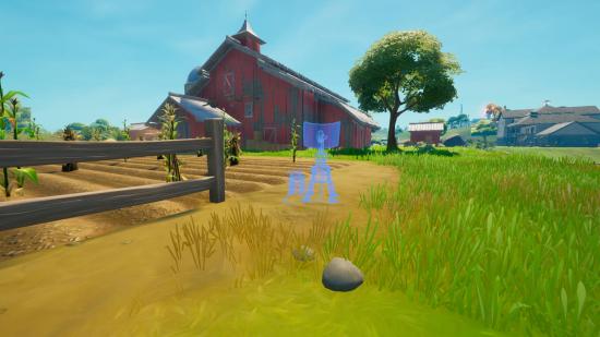 A blue outline of a jammer outside a red barn in Fortnite