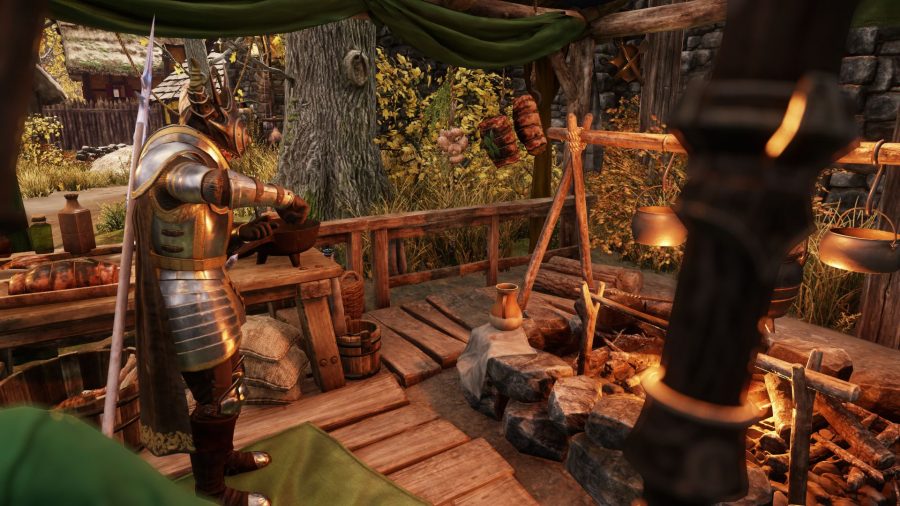 A player cooking at a stove in New World