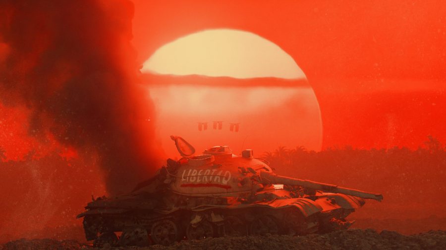 The sun sets over a tank with Libertad spray painted on the side