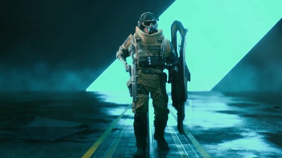 Santiago 'Dozer' Espinoza, the assault specialist, standing in front of a bright blue line in a dark room
