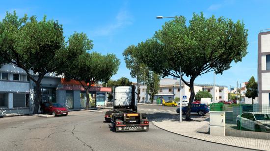 Driving down city street in Euro Truck Simulator 2
