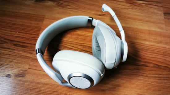 EPOS H6Pro white headset on woodgrain backdrop
