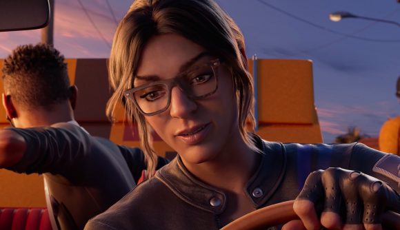 A woman with glasses and brown hair takes the wheel of a car in Saints Row gameplay footage