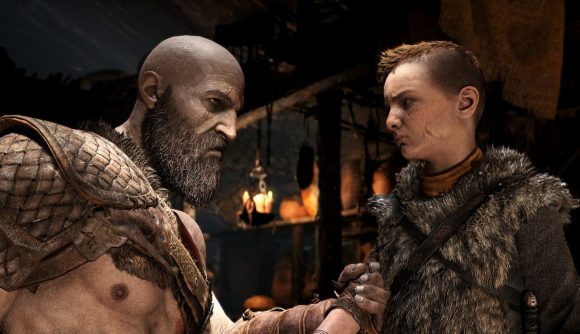 God of War screenshot with Kratos grabbing Atreus