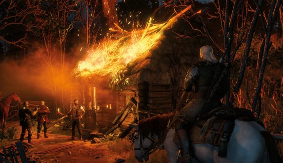 Geralt approaches a burning house on horseback in The Witcher 3