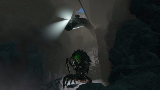 Best Fallout 4 mods: A mirelurk queen with a strange green glow traverses a cave with a rope ladder lying against the wall behind it