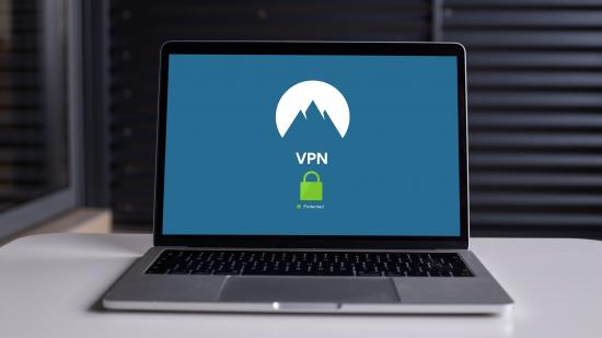 A laptop sitting on somebody's desk with a non-brand specific VPN on screen.