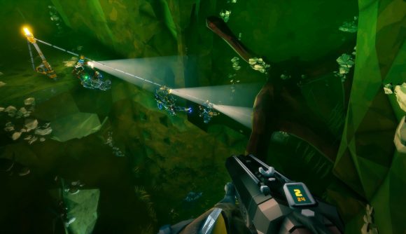 Dwarves travel along an underground zip line over a chasm in Deep Rock Galactic.