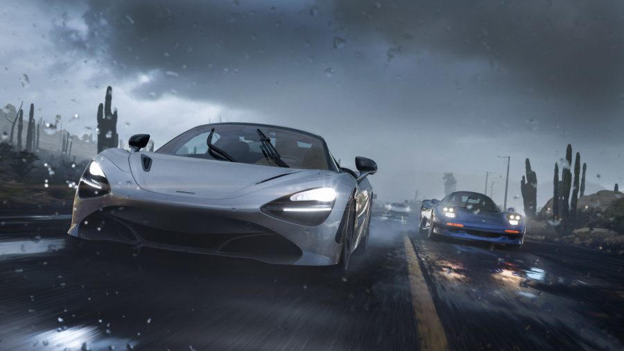 A screenshot from Forza Horizon 5, featuring two cars racing down a rain soaked road at night