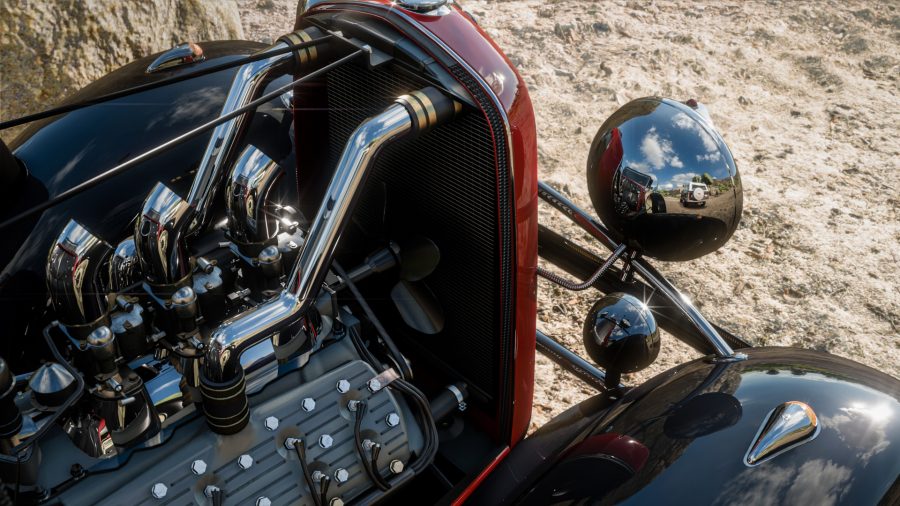 A screenshot from Forza Horizon 5, featuring a close up of a car's front body with chrome headlights