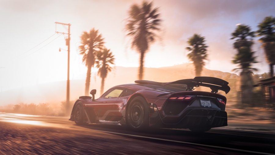 A screenshot from Forza Horizon 5, featuring a car driving into the Mexican sunset