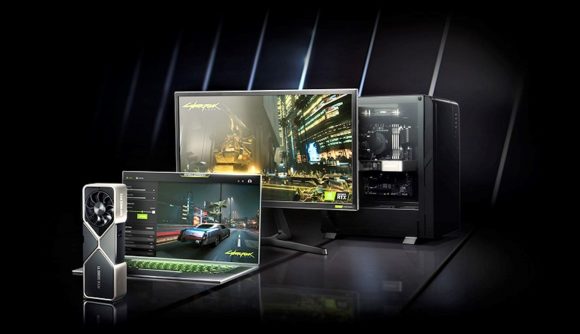 Nvidia RTX 3090 card in front of laptop, monitor, and computer case