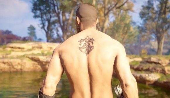 A shirtless Eivor displaying the Assassin's Creed Brotherhood tattoo in Valhalla