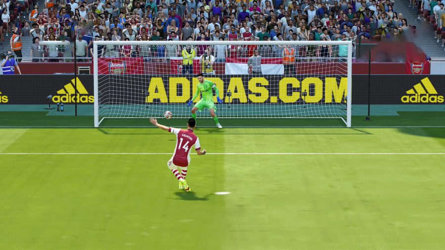 Aubameyang shooting the ball to the left of the goalkeeper as he takes a penalty kick in FIFA 22