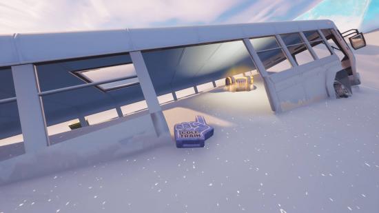 A foam finger with 'Cole Train' written on it is one of the Thrashball memorabilia lying next to an abandoned bus semi-submerged in snow in Fortnite.