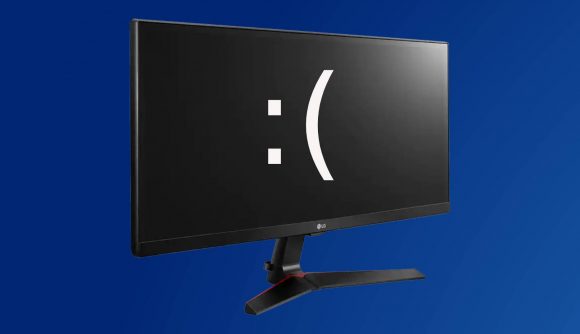 gaming monitor with colon bracket sad face on blue backdrop