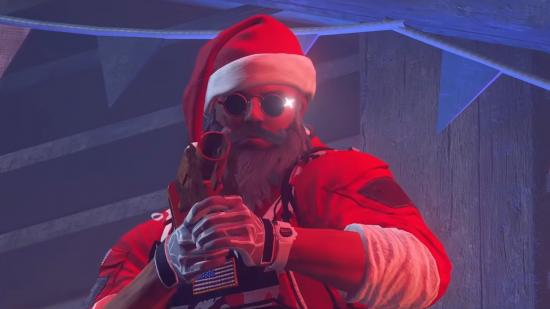 Rainbow Six Siege's Blackbeard is dressed as Santa for 2021's holiday Snow Brawl limited time event.