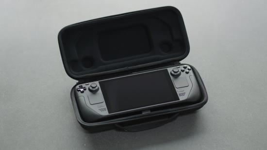 A DV manufacturing build of Valve's Steam Deck handheld gaming PC, sitting in its clamshell case