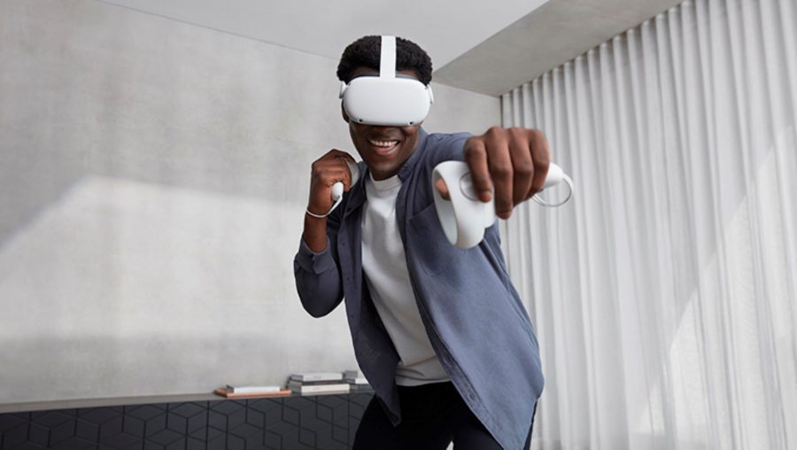 Oculus Quest 2 in use by player holding controllers towards camera