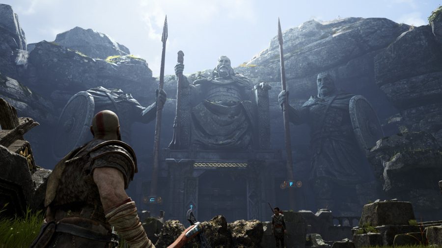 Kratos and Atreus stand in awe of three statues