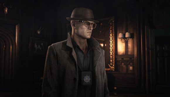 Agent 47 is dressed as a detective in a fedora and tweed overcoat in the Dartmoor level in Hitman 3.