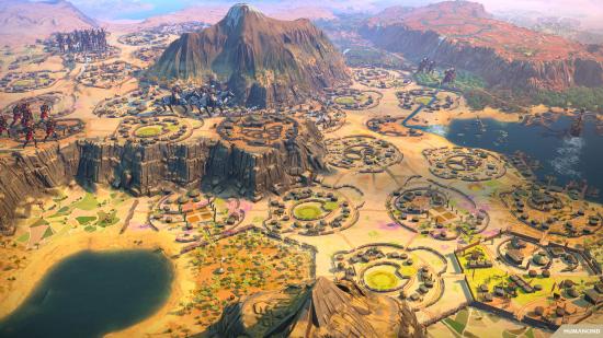 Humankind settlements in the Cultures of Africa DLC pack feature ring walls around ancient-style huts, as cavalry march atop a ridge.