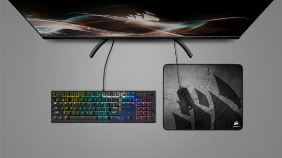 A Corsair gaming keyboard, mouse and mouse pad, all part of the Corsair Pro Gaming Bundle.