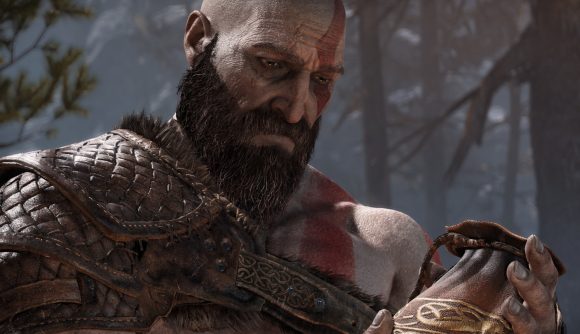 Kratos looks down sadly in God of War
