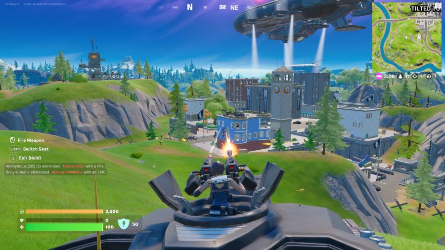 Fortnite tank locations: The player is shooting at a building using a turret at the top of the tank.