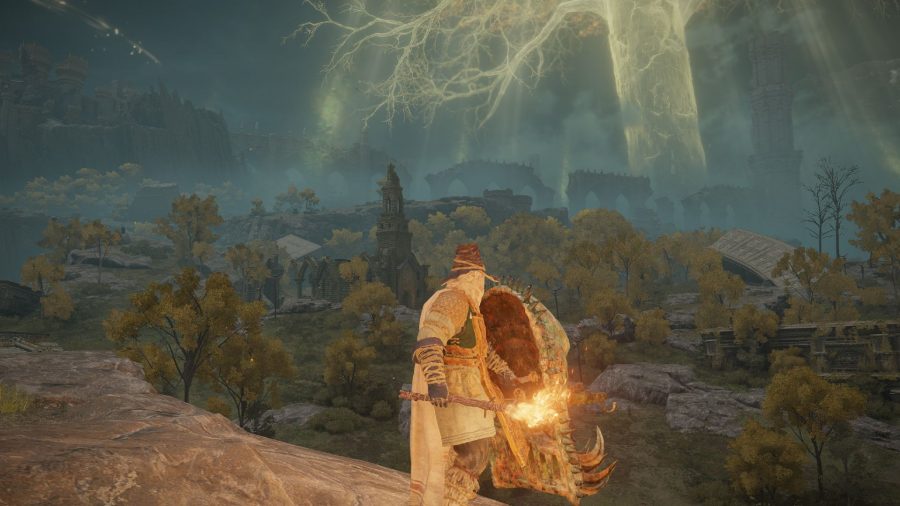 Elden Ring dying twice: looking out across Limgrave with a torch in one hand and a greatshield in the other